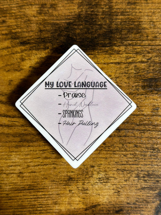 Card with 'My Love Language' text on a wooden surface