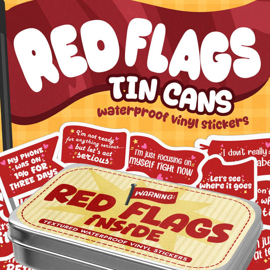 A tin of waterproof vinyl stickers branded 'Red Flags Tin Cans' with multiple red and white warning-style stickers displayed around and on top of the metal tin.