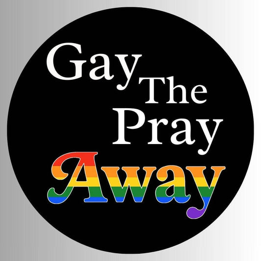 Round sticker with text 'Gay The Pray Away' in rainbow colors on a black background