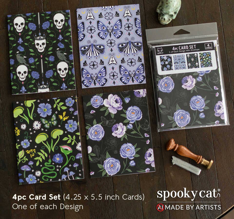 Four floral and nature-themed cards with packaging on a wooden surface, featuring the brand 'Spooky Cat'.