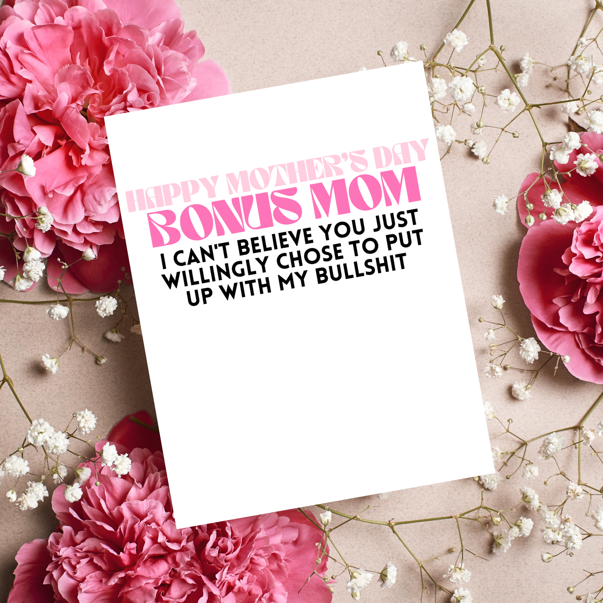 Card with humorous message on a background of pink flowers and white baby's breath.
