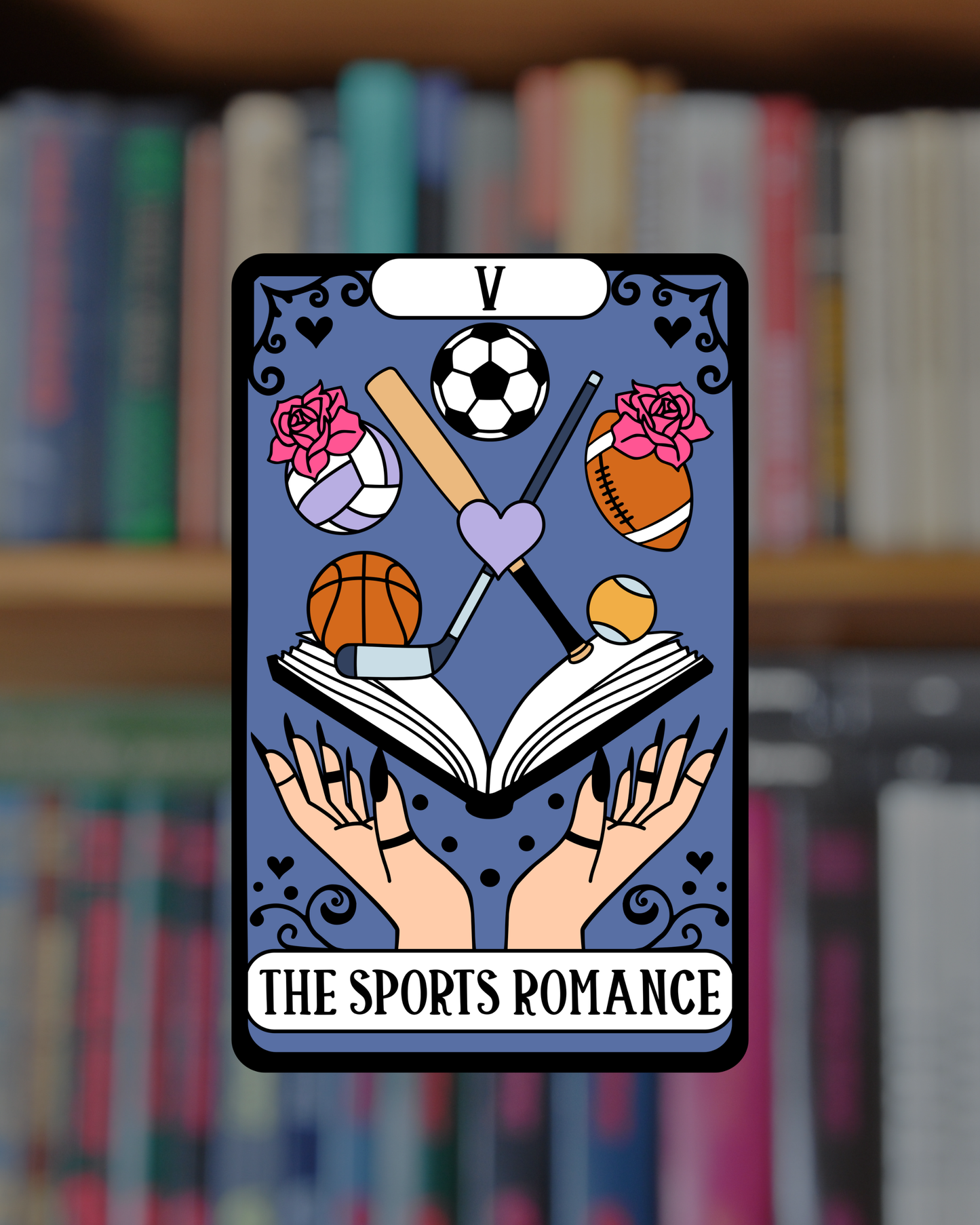 Card with sports-themed design and 'The Sports Romance' text, against a blurred bookshelf background.