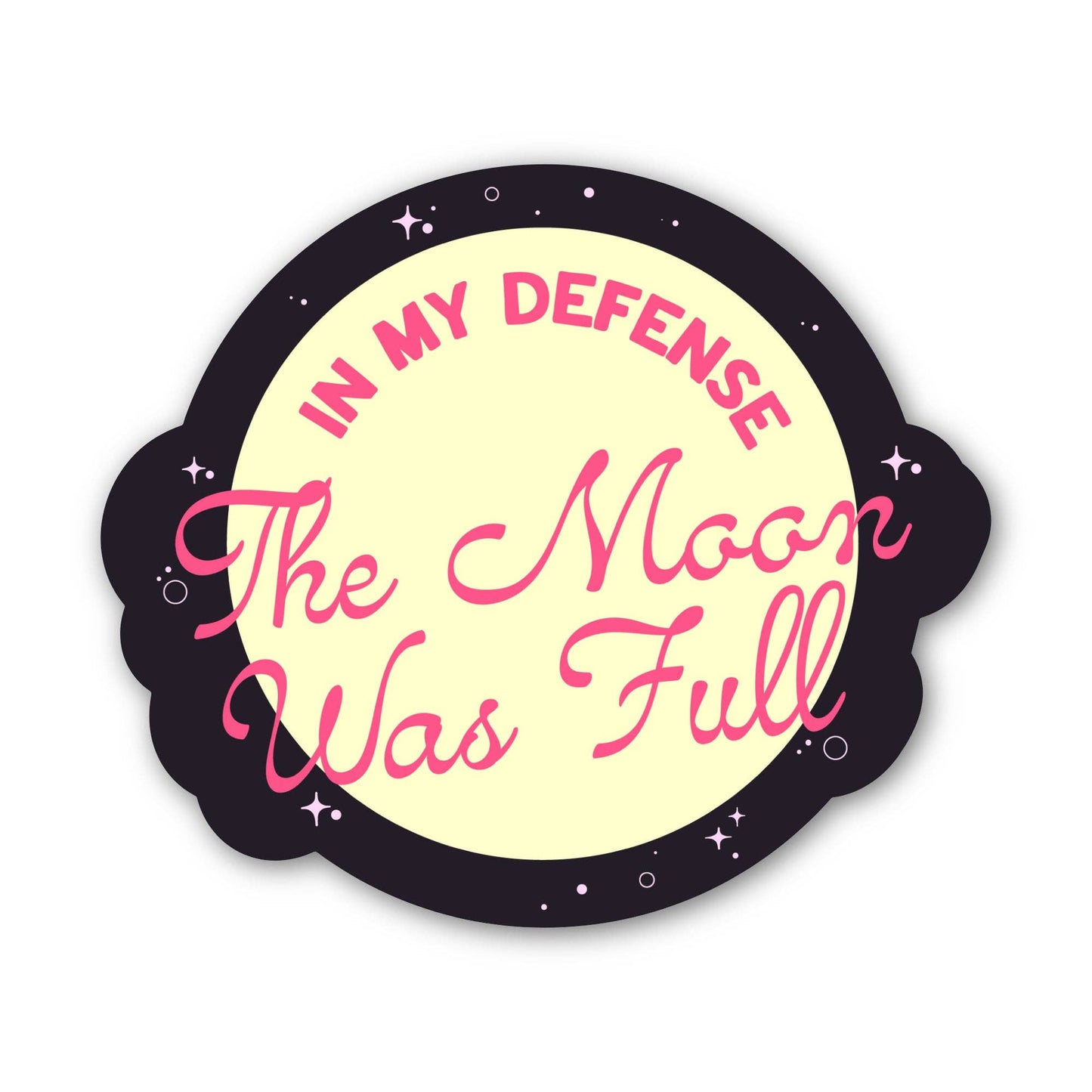 A die-cut sticker featuring a pale yellow moon graphic with pink text reading 'IN MY DEFENSE The Moon Was Full' and a dark purple outer ring decorated with small white stars, shown on a plain white background.