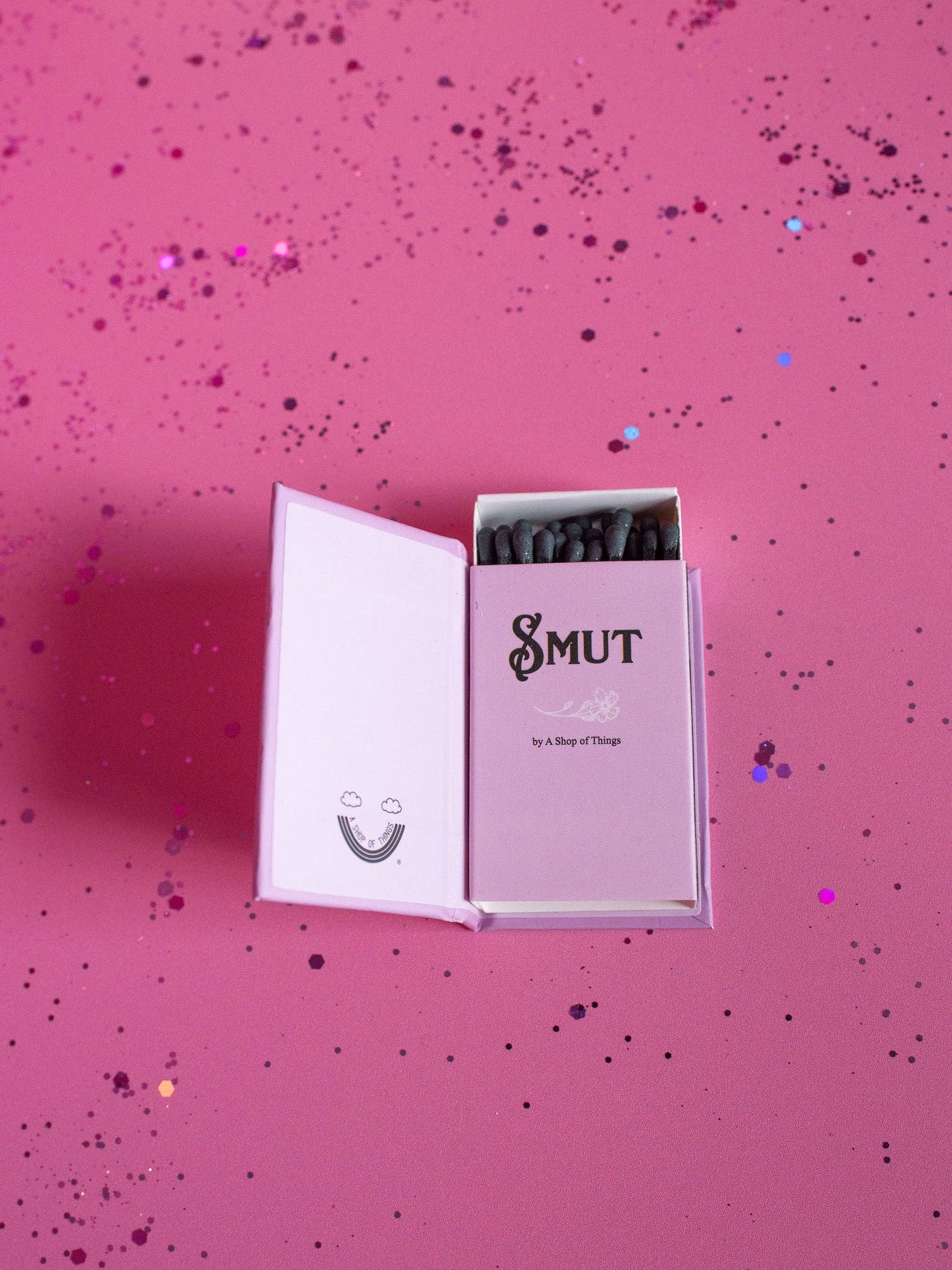 Product packaging with 'Smut' branding on a pink background