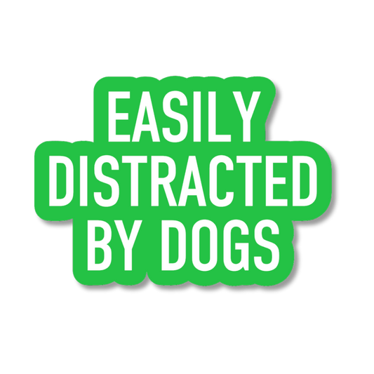 Green sticker with white text 'EASILY DISTRACTED BY DOGS' on a white background