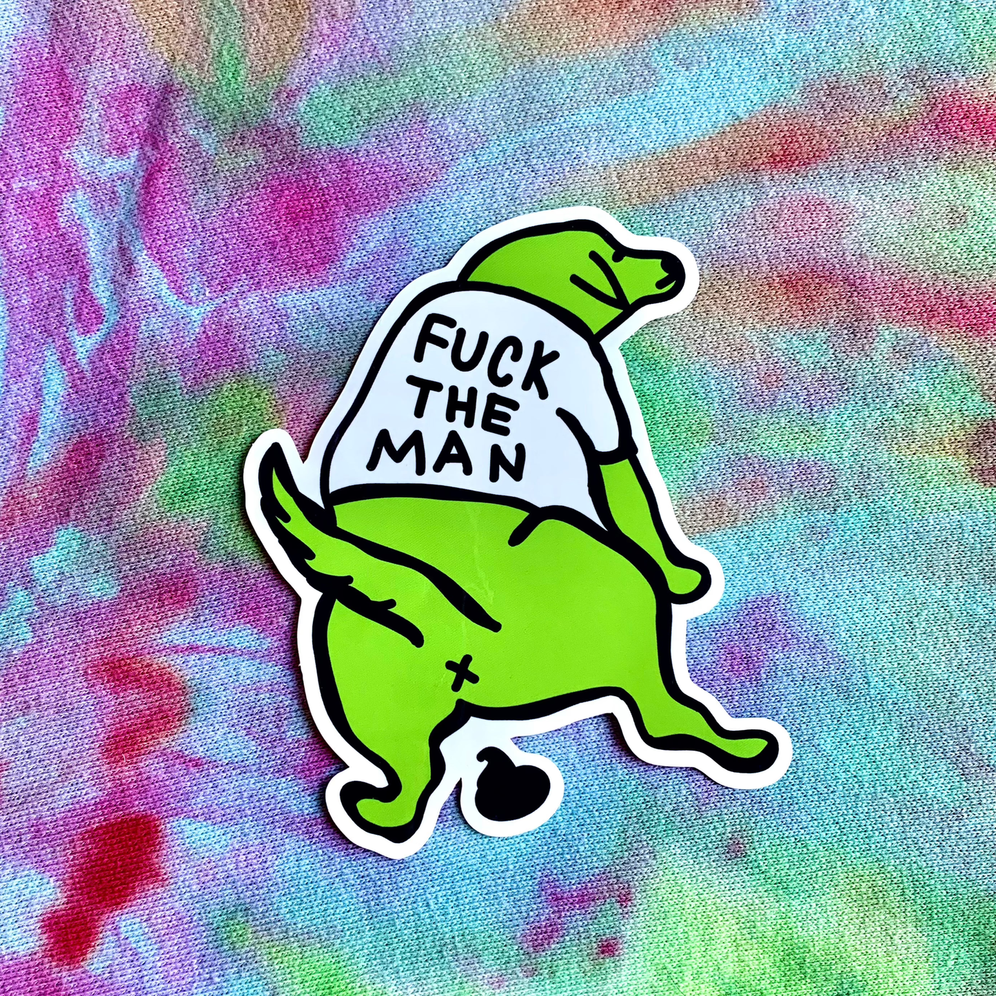 Green cartoon character with a shirt reading 'F*ck the Man' on a tie-dye background