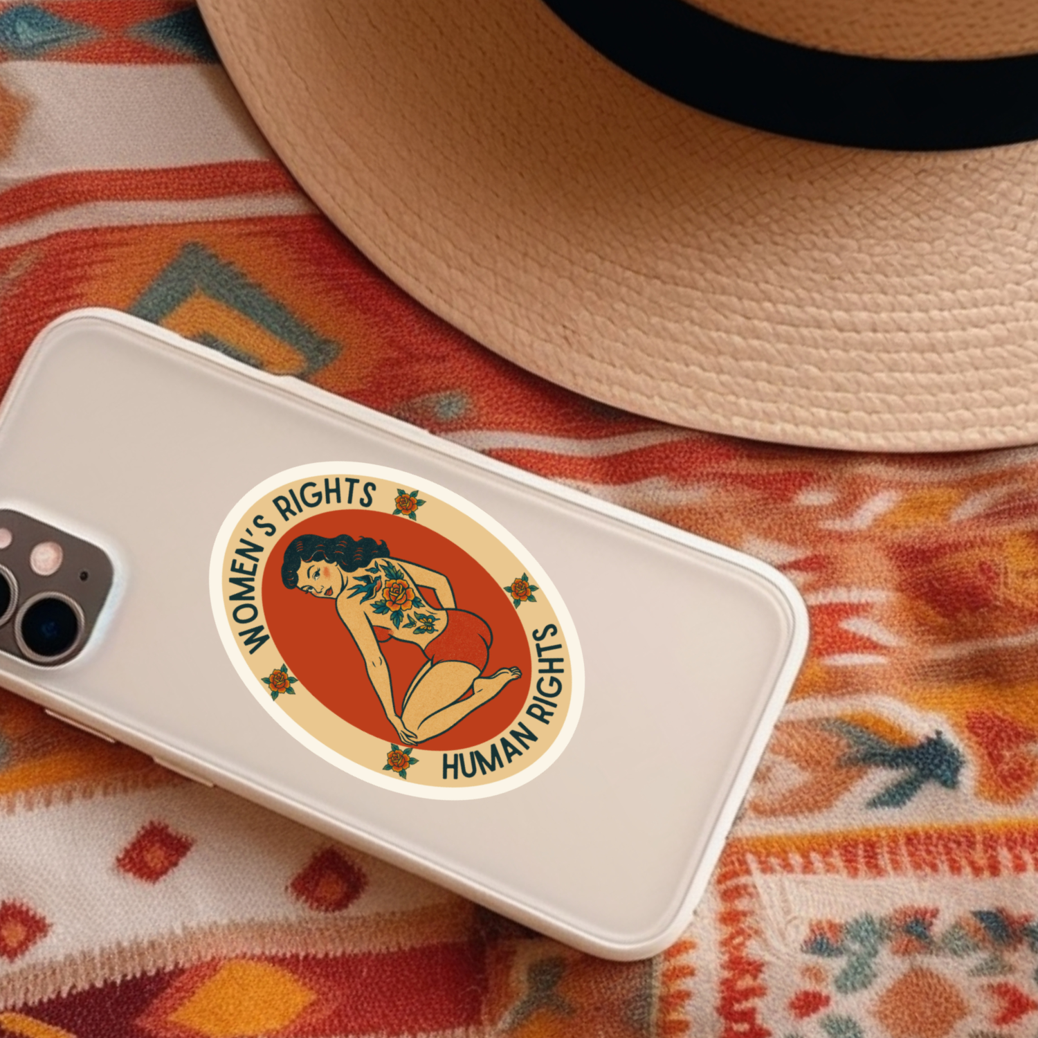Phone case with 'Women's Rights Are Human Rights' design on a colorful fabric background