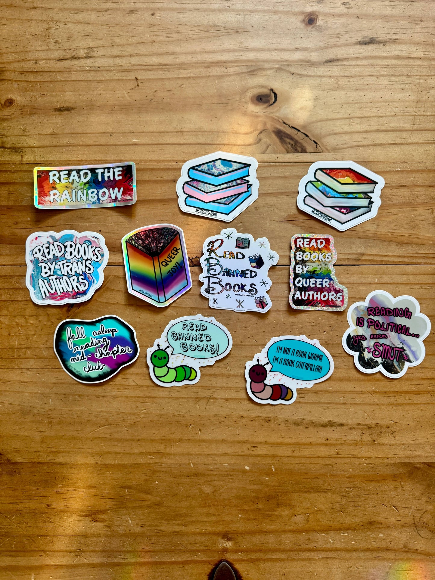 Collection of colorful stickers on a wooden surface
