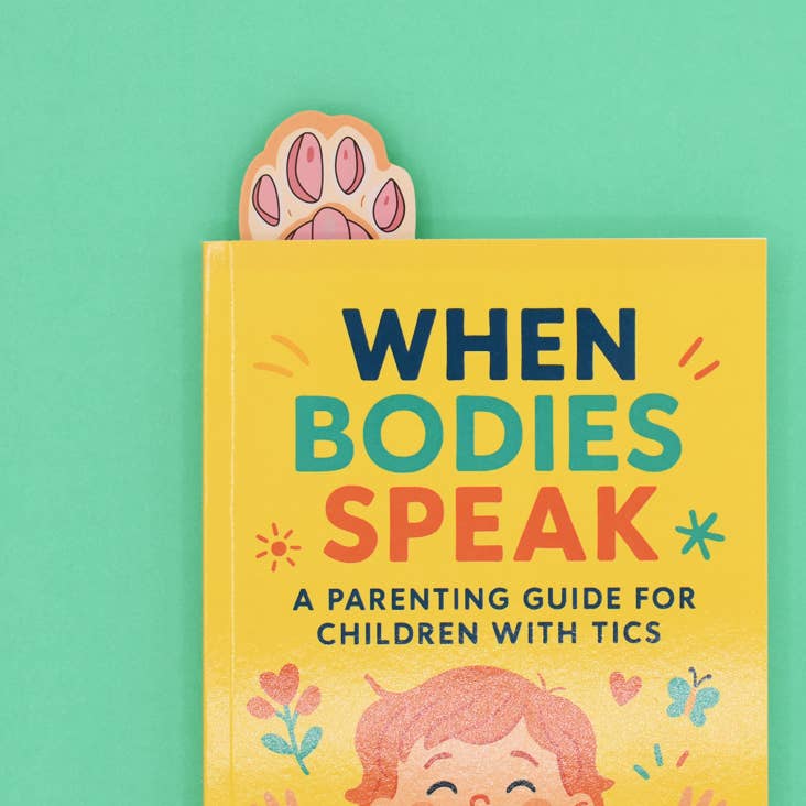 Book titled 'When Bodies Speak' with colorful text and illustrations on a green background