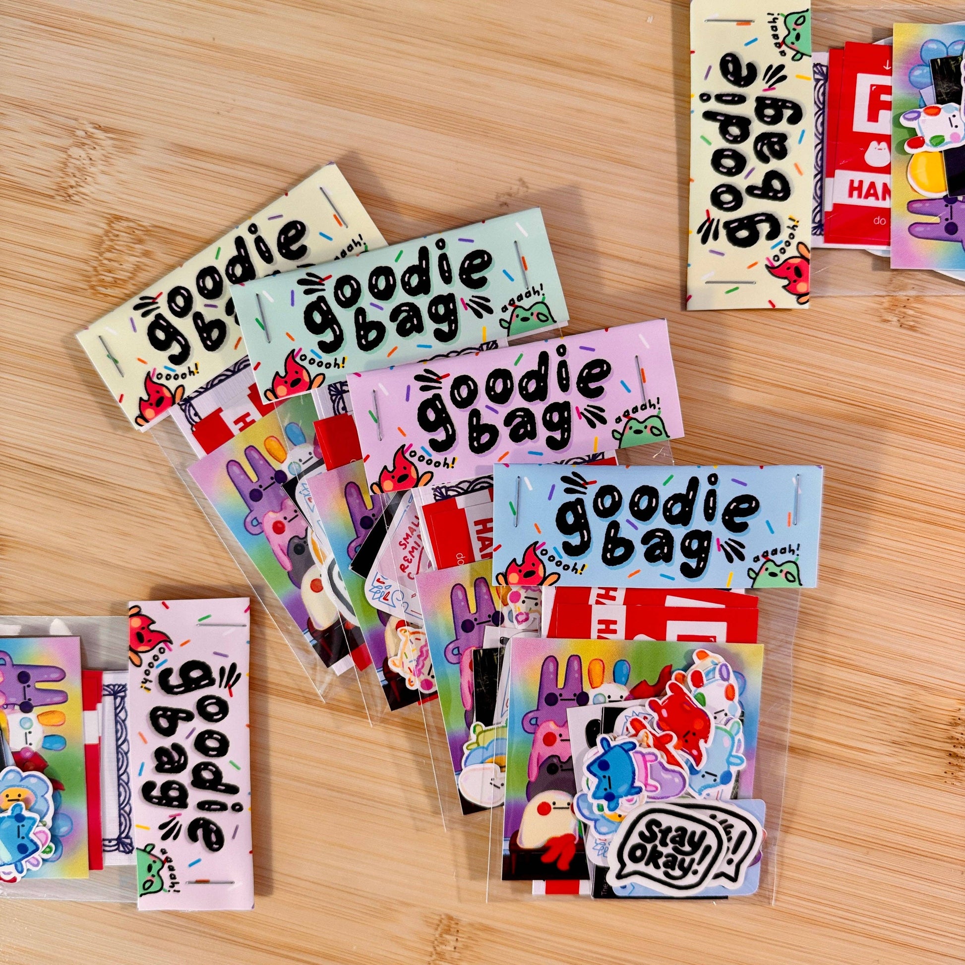 Colorful 'goodie bag' packaging on a wooden surface