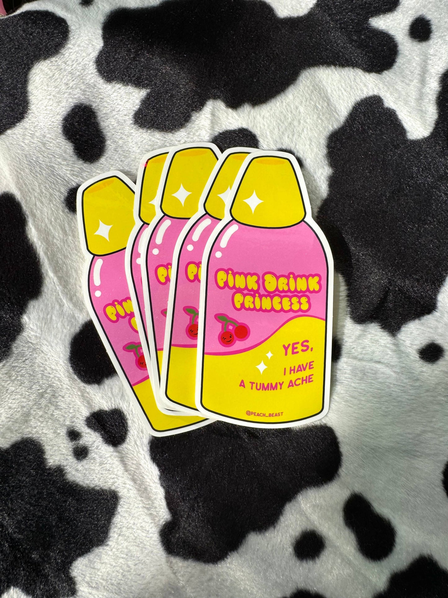 Sticker of 'Pink Drink Princess' on a cow print background