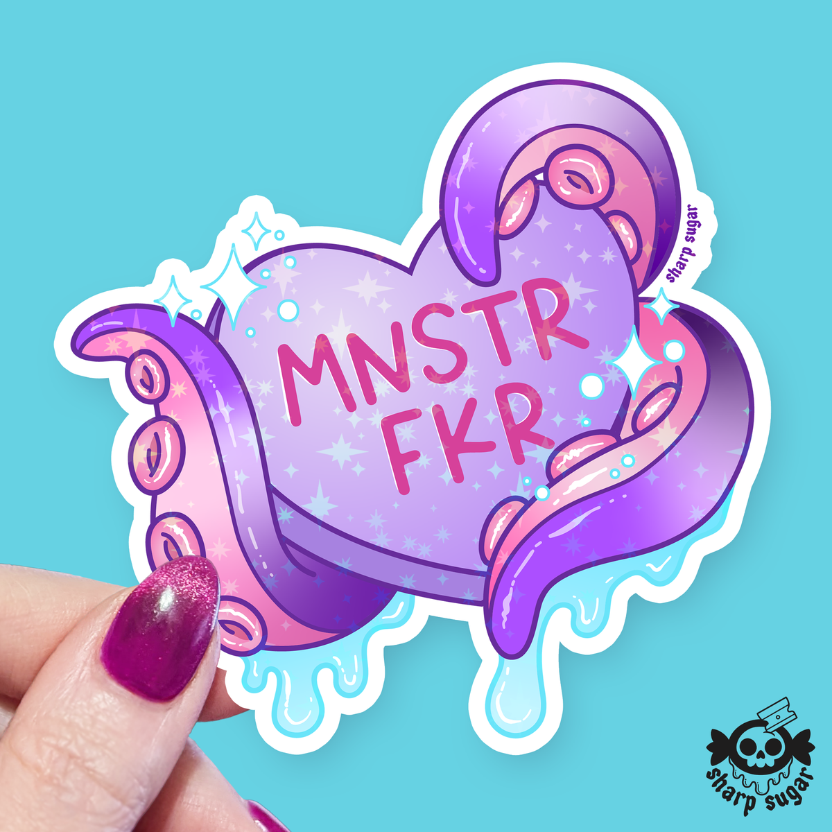 A die-cut sticker featuring a stylized purple octopus wrapping around a pink heart with the text 'MNSTR FKR' and small sparkles, held by a hand with glittery purple nail polish against a bright cyan background. A 'sharp sugar' logo appears in the bottom right corner.