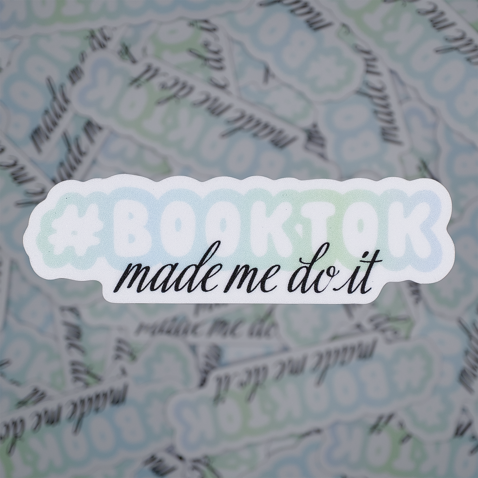 Sticker with 'Baking made me do it' text on a patterned background