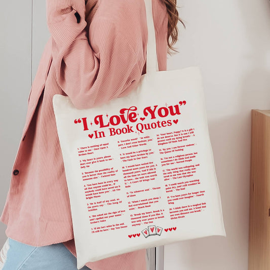 Person holding a tote bag with 'I Love You' in book quotes printed on it.