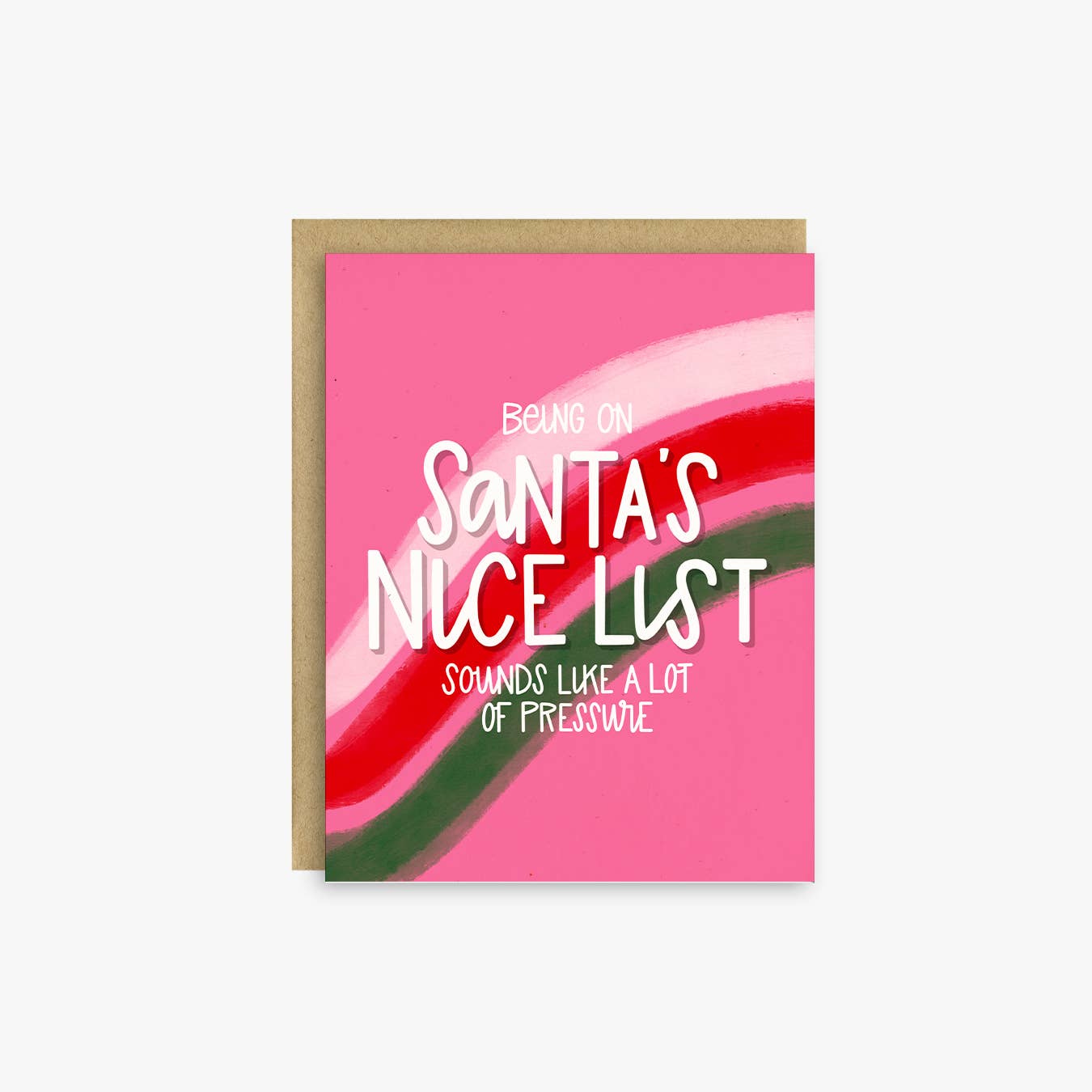 A greeting card with a kraft envelope, featuring a bright pink background with wavy red, white, and green stripes and the text 'BEING ON Santa's NICE LIST SOUNDS LIKE A LOT OF PRESSWIE'.