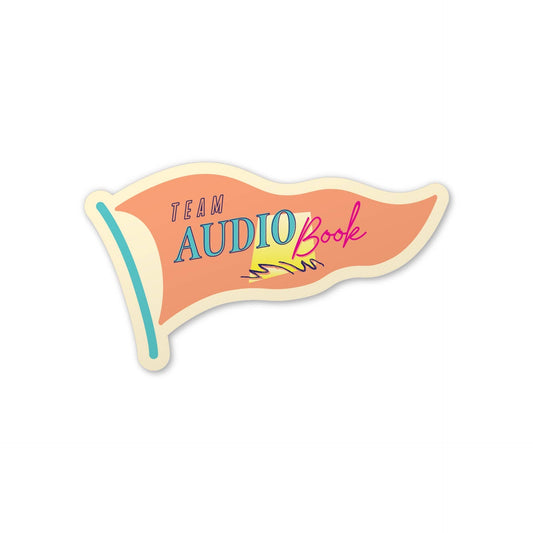 A die-cut sticker shaped like a retro wavy book cover or flag, with the words “TEAM AUDIO Book” in blue, pink, and purple lettering on a peach background, with a cream border and a small yellow accent, shown on a plain white background.