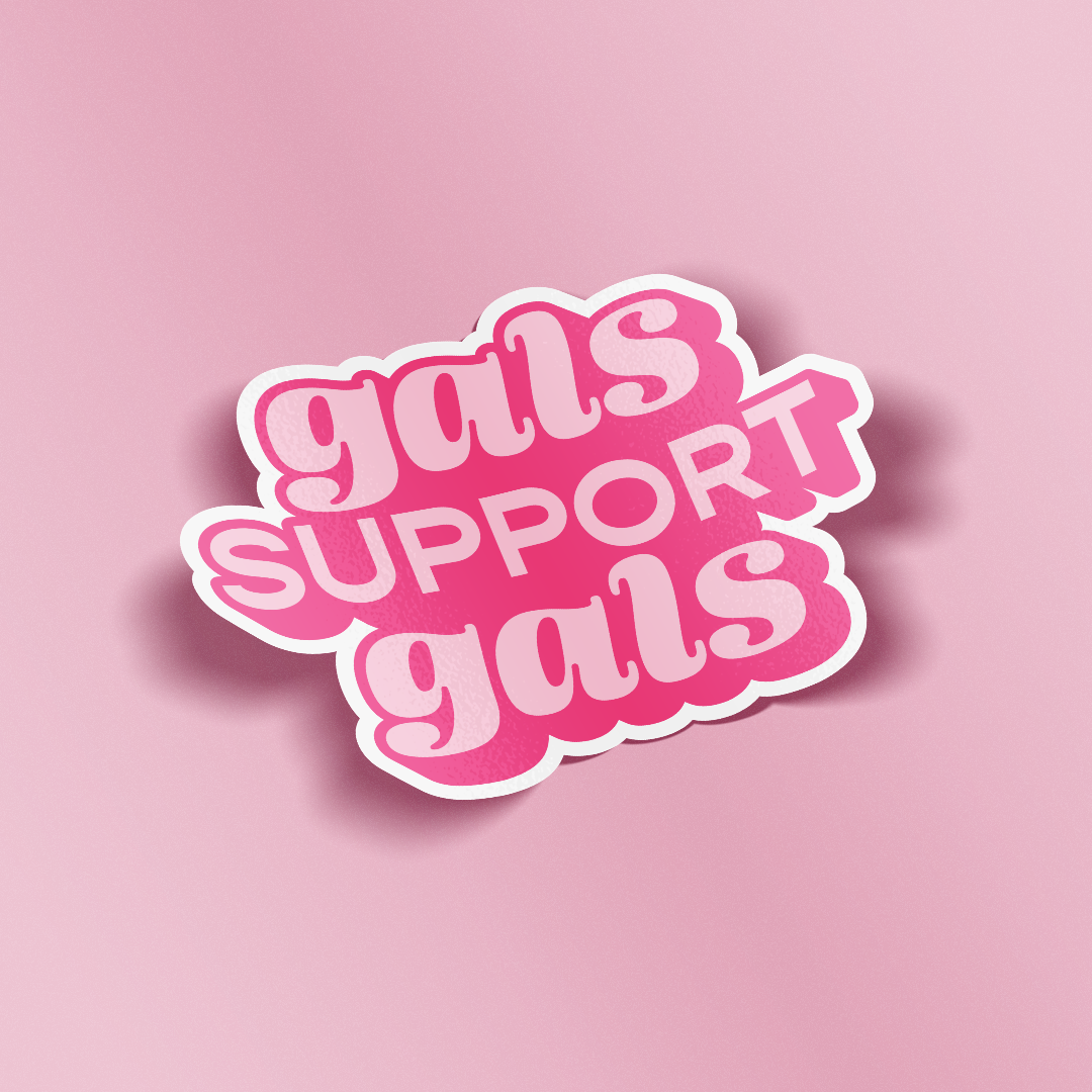 A die-cut sticker with the phrase 'gals SUPPORT gals' in pink bubble lettering with a white outline, shown on a solid pink background.