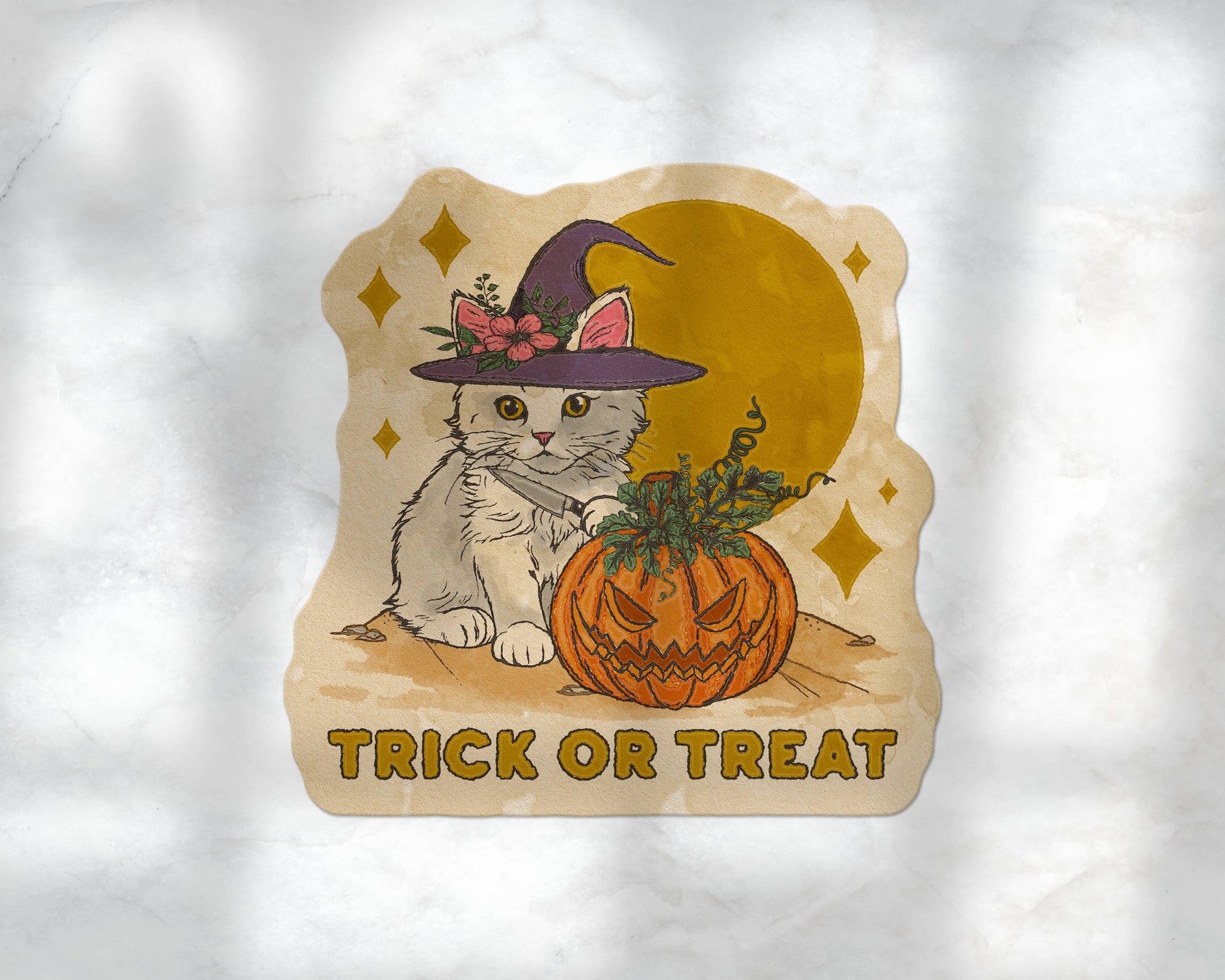 A die-cut sticker featuring a cute white kitten in a witch hat next to a carved orange pumpkin, with the words 'TRICK OR TREAT' below, shown on a textured white background.