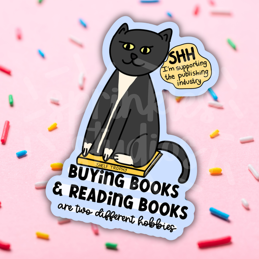 Sticker with a black cat and text on a pink background with colorful sprinkles
