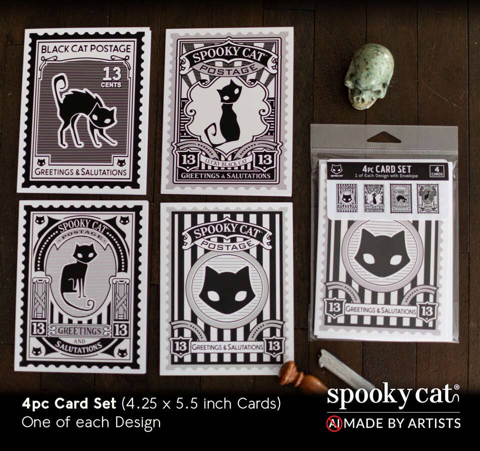 Set of 'Spooky Cat' themed cards with packaging on a wooden surface.