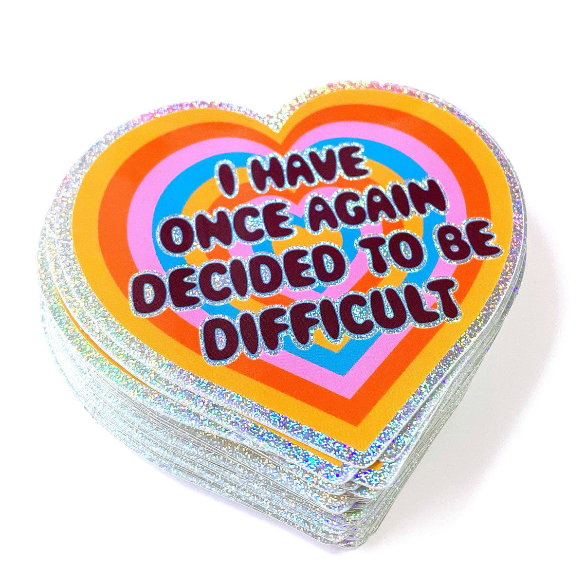Stack of heart-shaped cards with colorful text on a white background