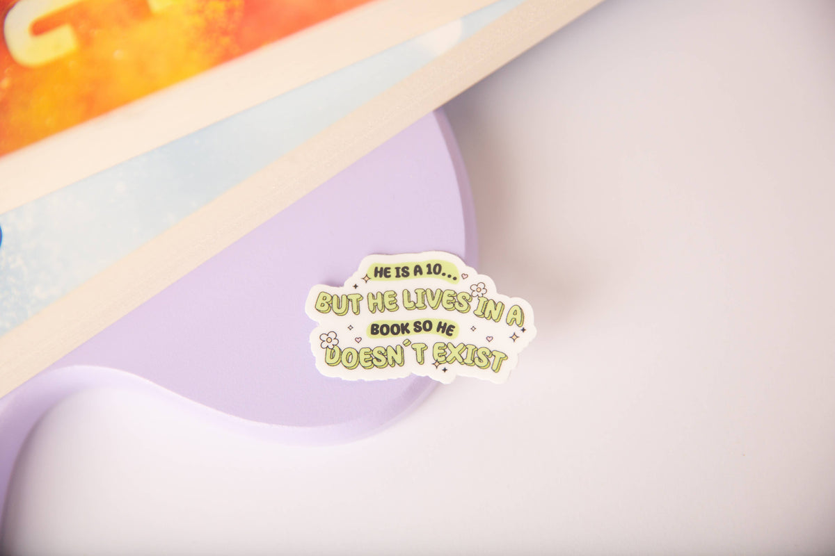 A die-cut sticker with the text 'HE IS A 10.