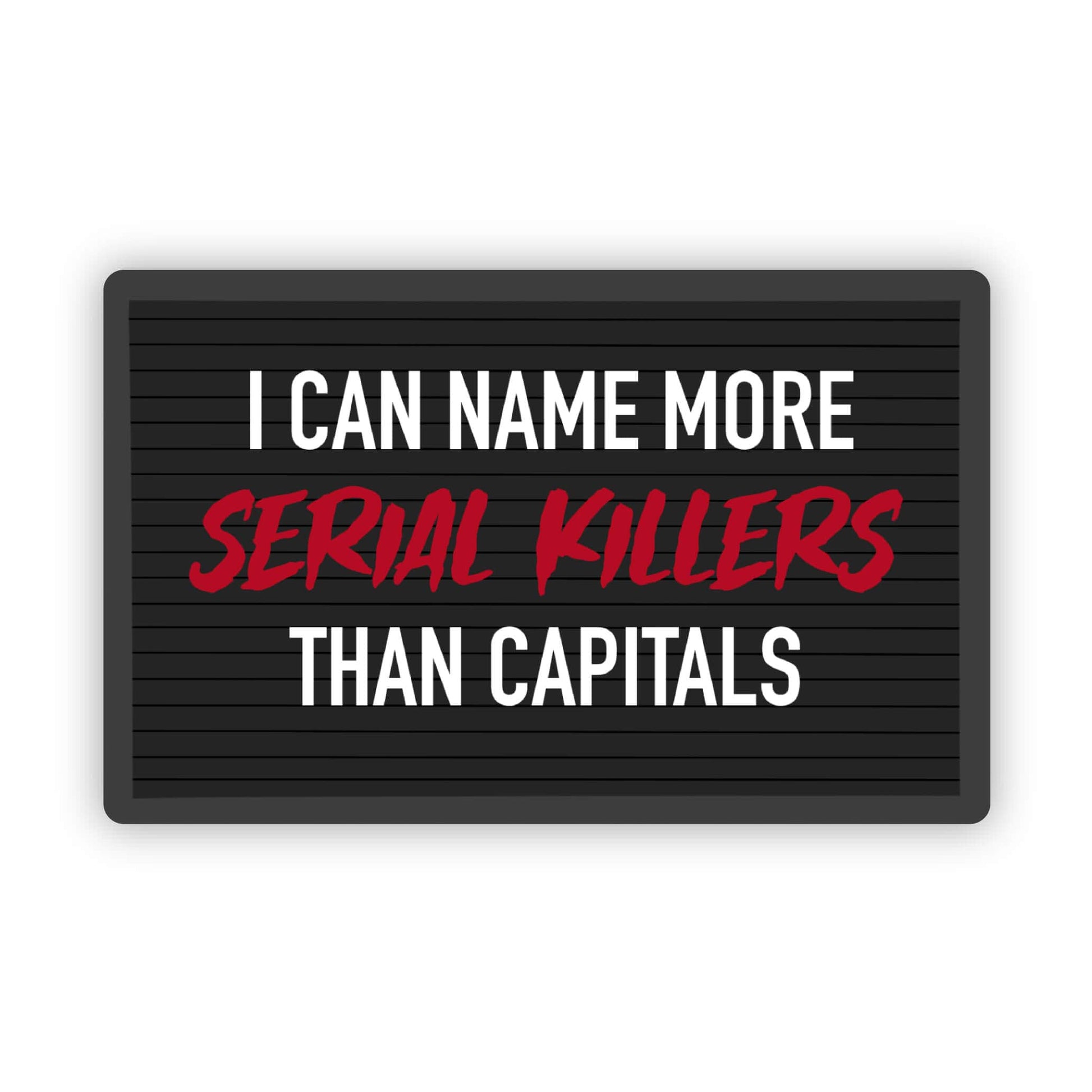 A rectangular black letter board sign with the text 'I CAN NAME MORE SERIAL KILLERS THAN CAPITALS' in white and red lettering, shown on a plain white background.