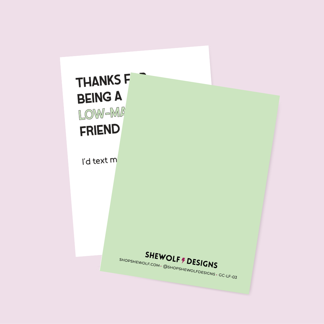 Light green card with text and Shewolf Designs branding on a light pink background