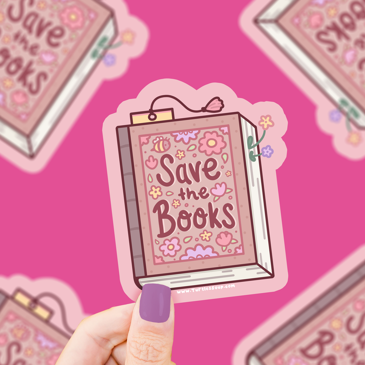 Sticker with 'Save the Books' design held by a hand against a pink background with similar stickers.