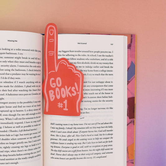 Book with a foam finger-shaped 'GO BOOKS!' bookmark on a colorful background