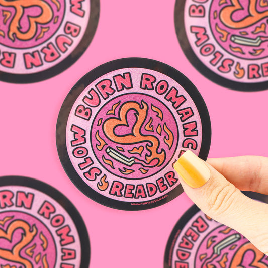 Sticker with 'Burn Romance Slow Reader' design on a pink background