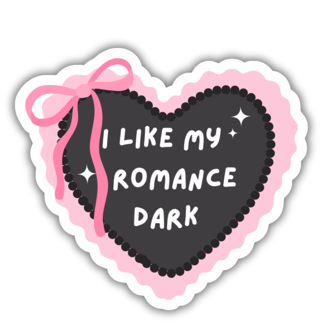 Heart-shaped sticker with 'I Like My Romance Dark' text and pink bow on a white background