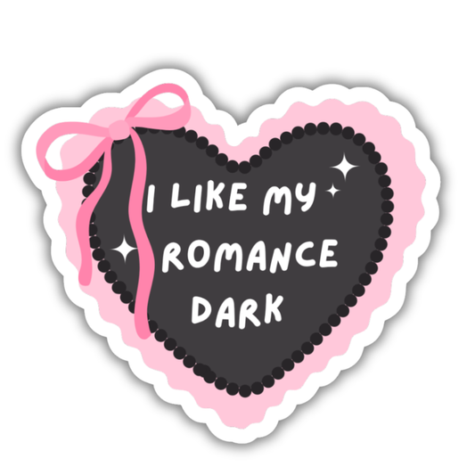 Heart-shaped sticker with 'I Like My Romance Dark' text and pink bow on a white background