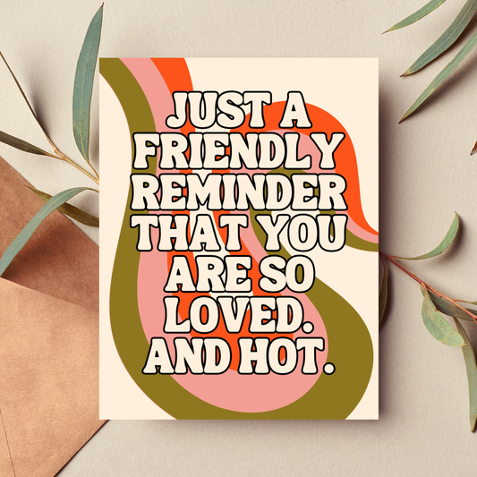 Greeting card with text 'Just a friendly reminder that you are so loved. And hot.' on a beige background with leaves.