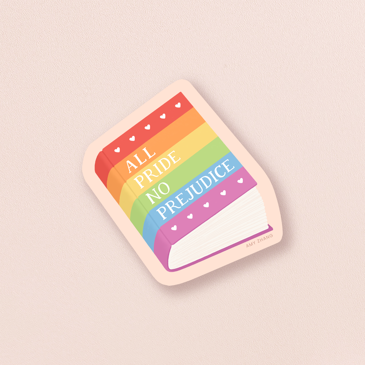 Rainbow-colored sticker with 'All Pride No Prejudice' text on a beige background