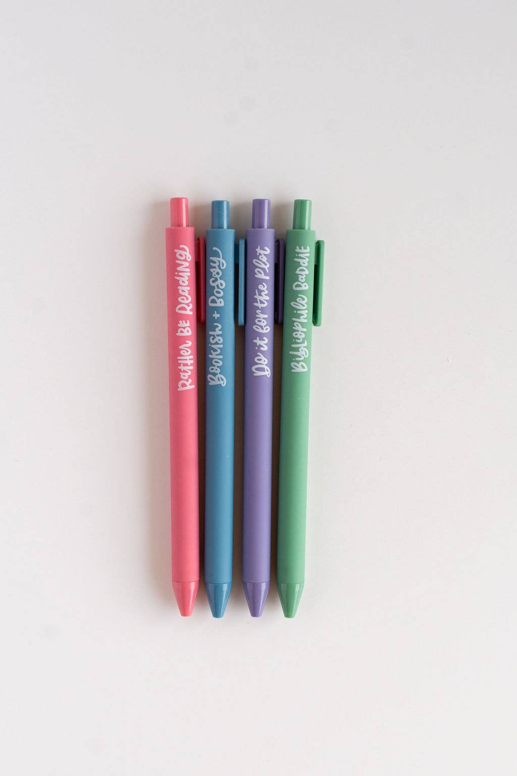 Four colorful pens with text on a white background