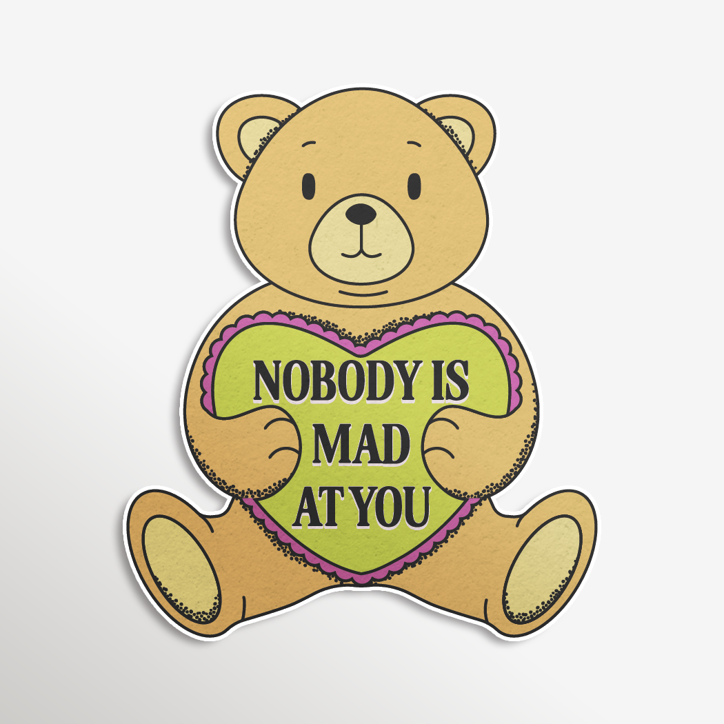 Cartoon teddy bear with a green heart saying 'Nobody is mad at you' on a light gray background
