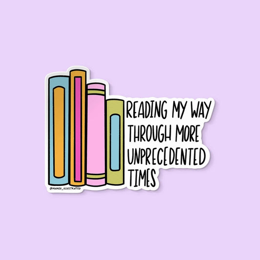 Colorful books with text 'Reading my way through more unprecedented times' sticker on a light purple background