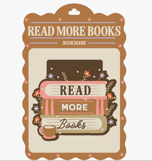 A decorative bookmark card with a scalloped brown border and the words 'READ MORE BOOKS' at the top. The center shows stacked illustrated books with 'READ MORE Books' and a small coffee cup, surrounded by small flowers and stars on a light background.