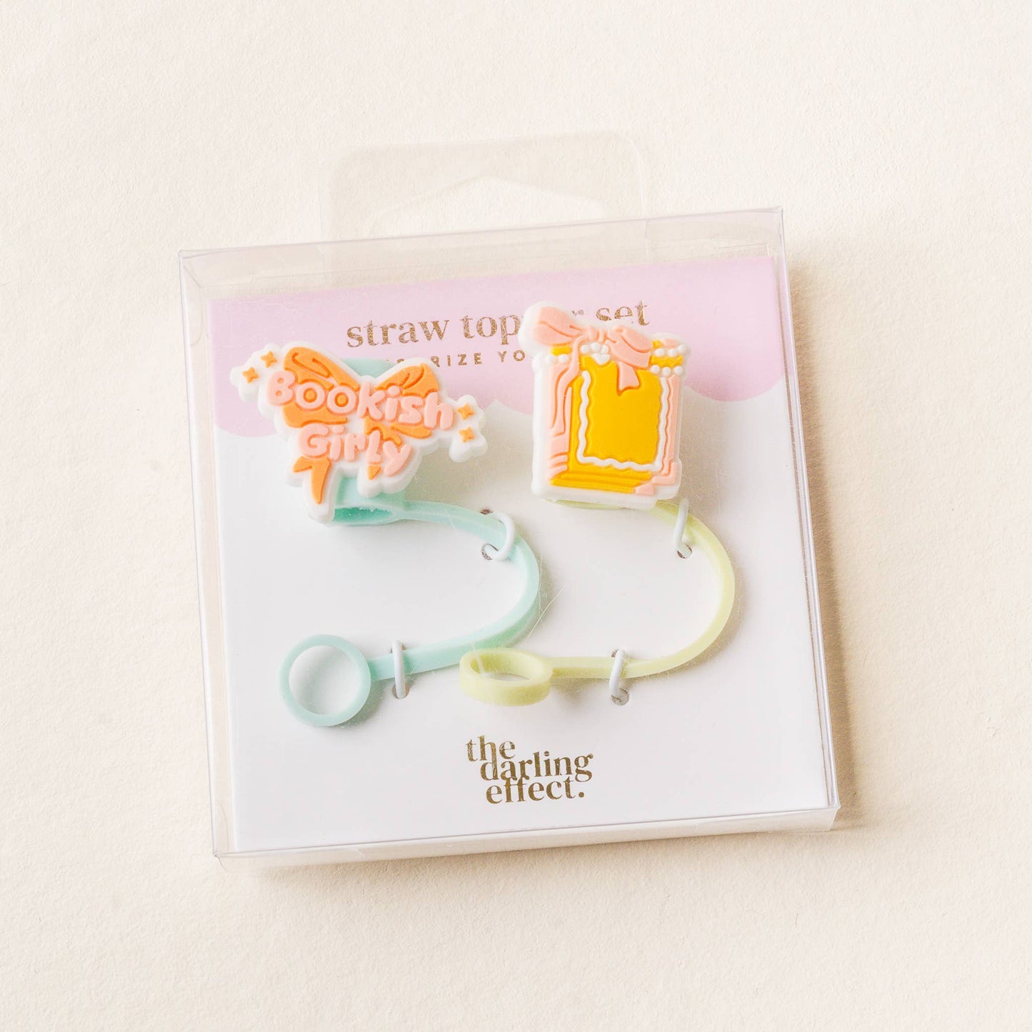 Packaged straw top set with colorful design on a light background