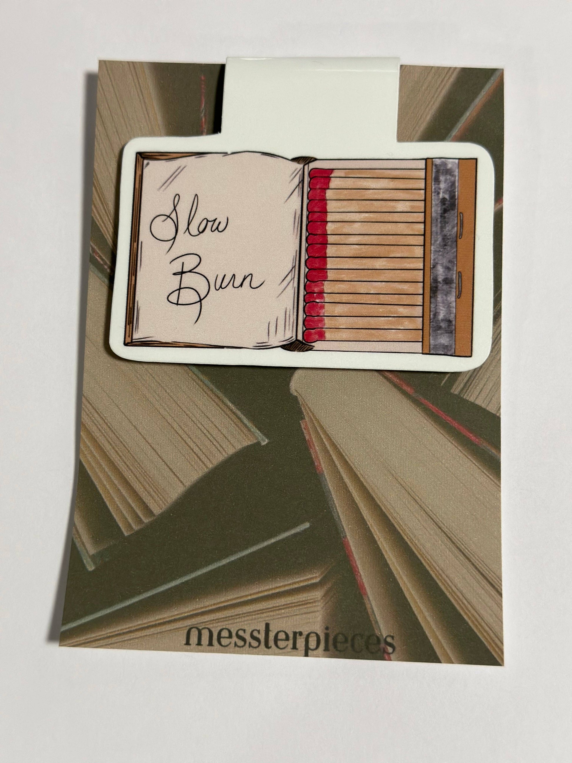 Card with 'Slow Burn' text and book design, featuring the brand 'messterpieces'.