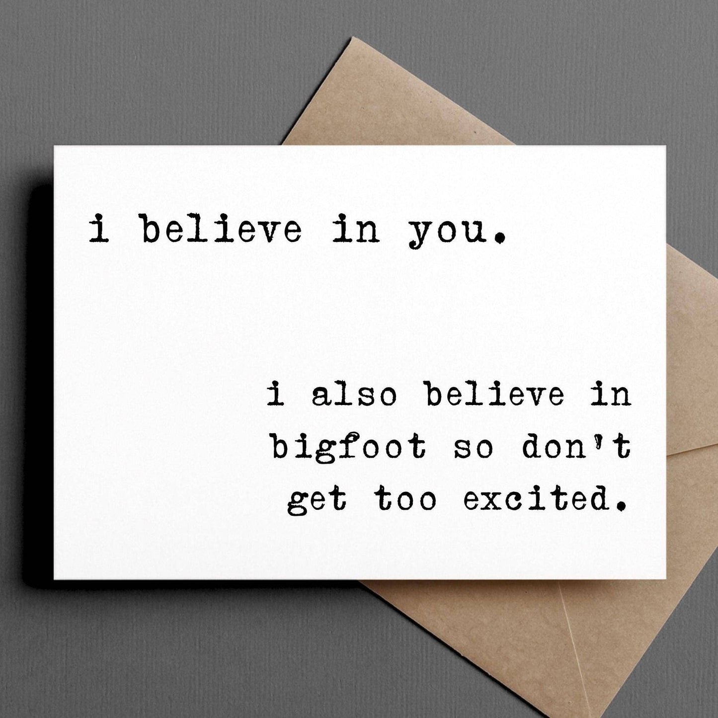 Card with text 'i believe in you. i also believe in bigfoot so don't get too excited.' on a gray background.