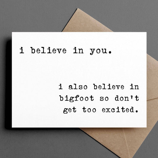 Card with text 'i believe in you. i also believe in bigfoot so don't get too excited.' on a gray background.