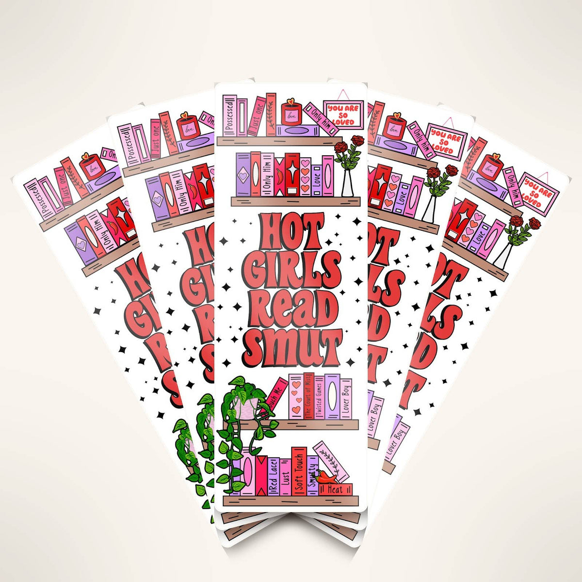 Sticker design with books and text 'Hot Girls Read Smut' on a white background