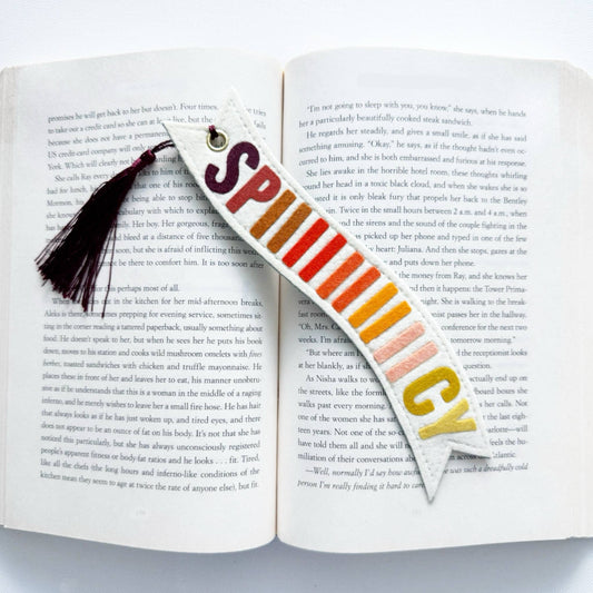 Colorful bookmark with tassel on an open book