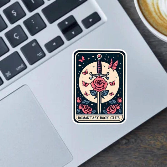 Sticker with a sword and roses design on a laptop