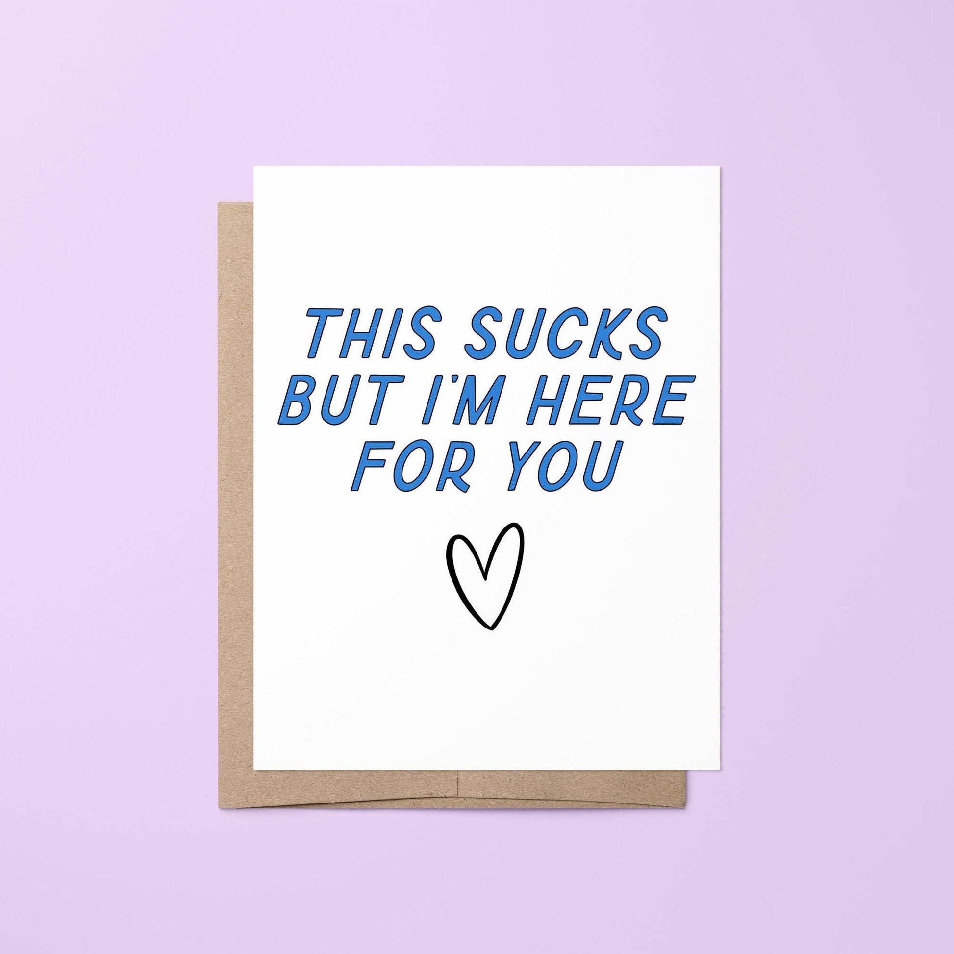 Card with 'This sucks but I'm here for you' text on a purple background