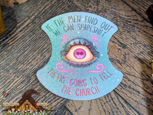 Decorative eye-shaped card with text on a wooden surface, featuring the brand 'Witchbirch Cottage'.