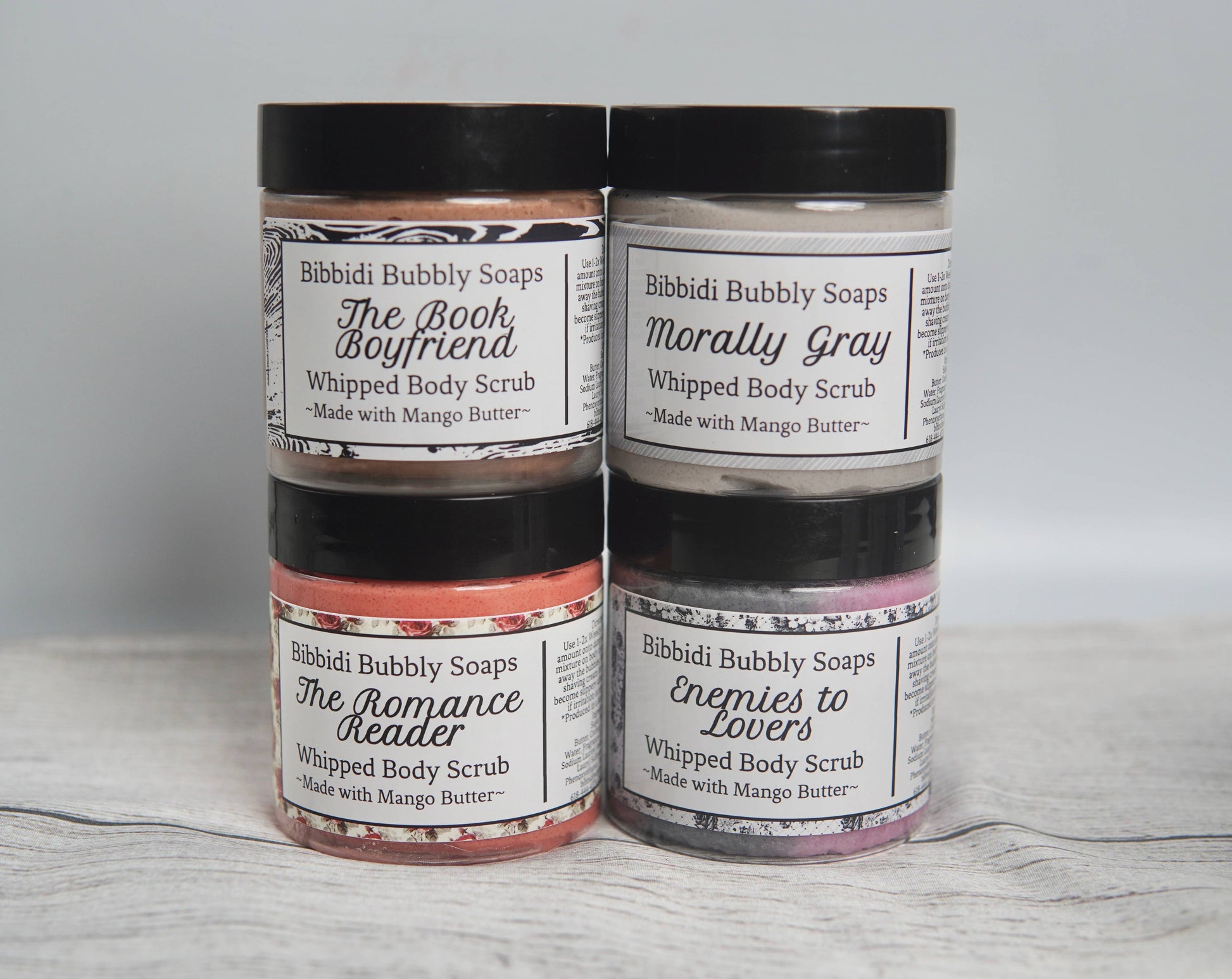 Two jars of Bibbidi Bubbly Soaps with decorative labels on a light gray background