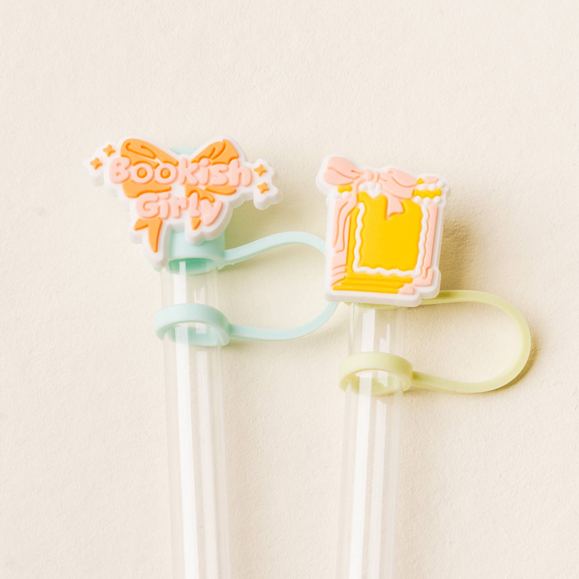 Decorative straw holder with bow and heart design on a beige background